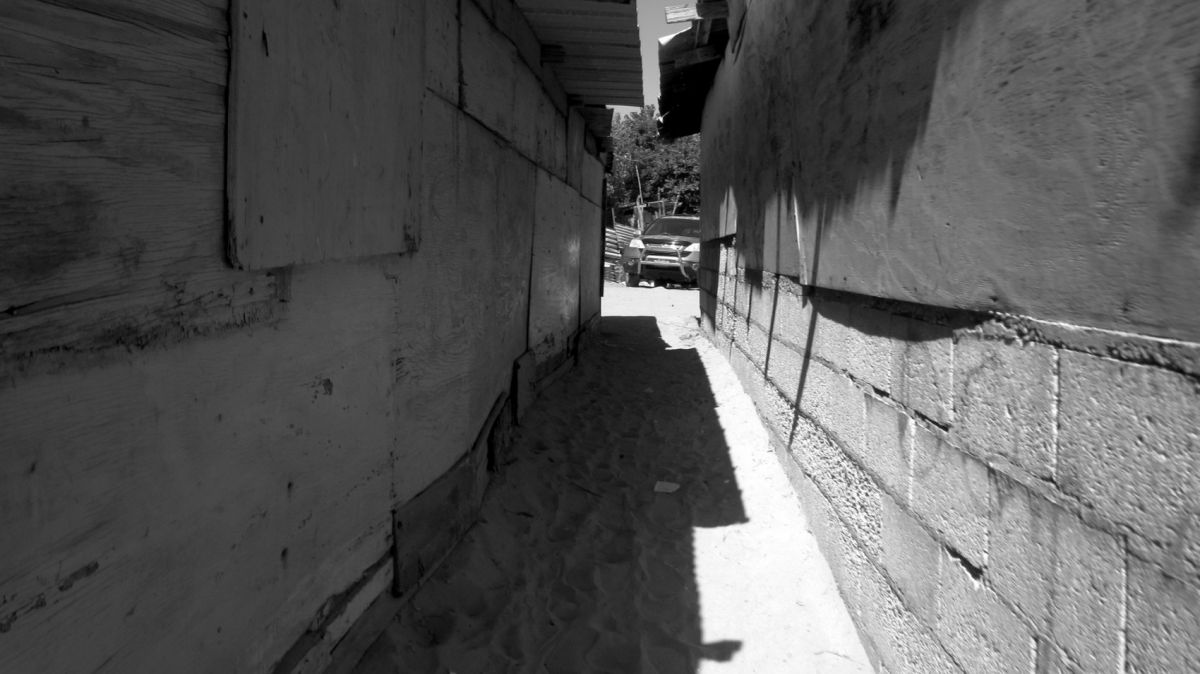 Alleyway between shacks
