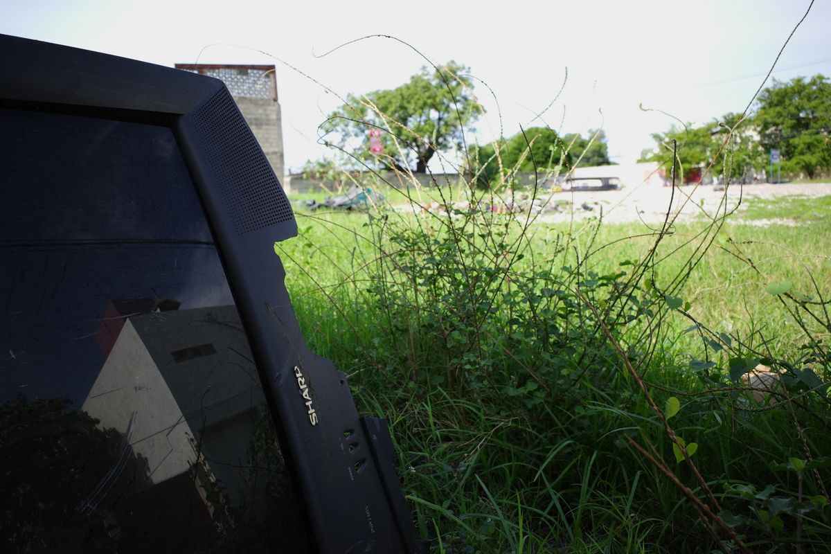 Old tv dumped in a open lot.