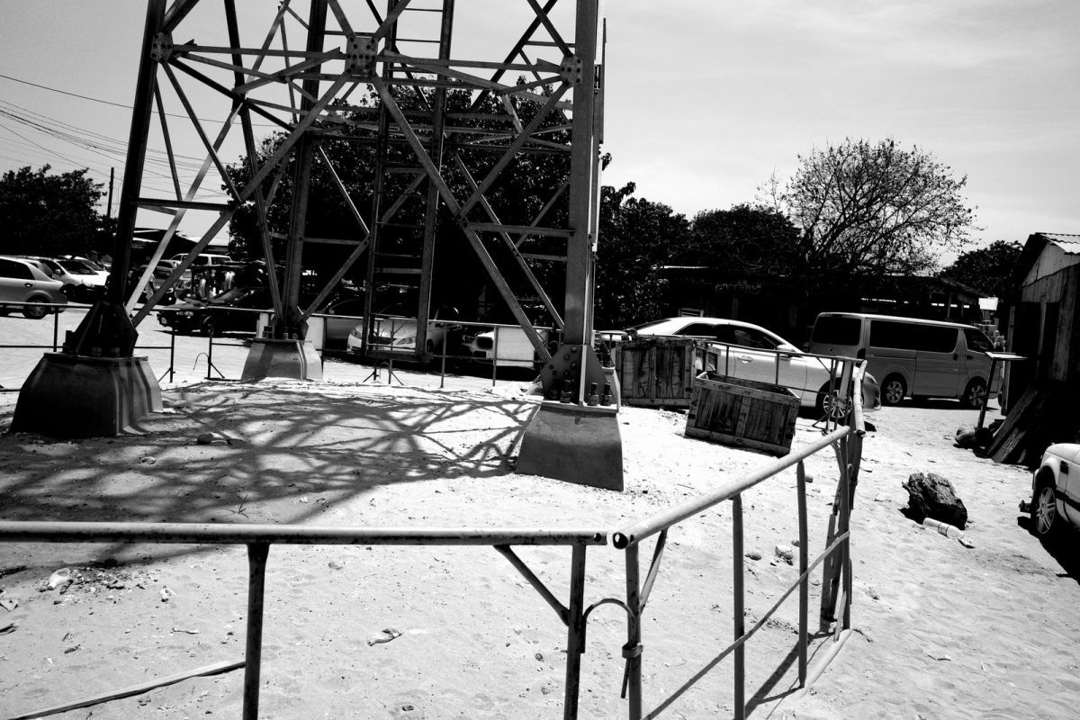 Light house in parking lot.