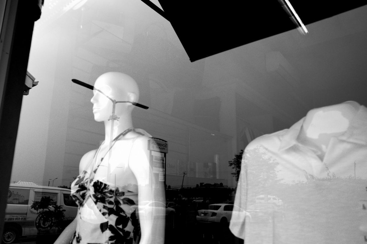 Reflection on glass on mannequin